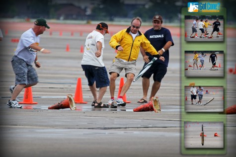 Course workers attempt to remove a muffler from course at the 2011 TireRack SCCA Solo National Championships